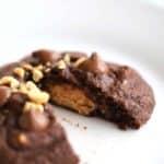 A Peanut Butter Cup inside a chocolaty chocolate chip cookie, ooey gooey goodness | Thecarefreekitchen.com