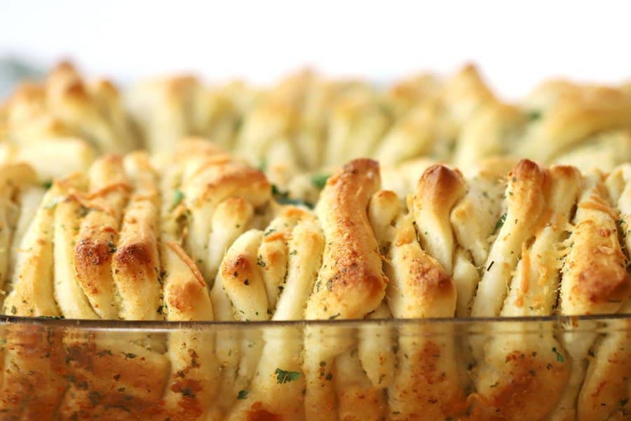 garlic pull apart bread baked till golden in a baking dish, fancy garlic bread recipe. 