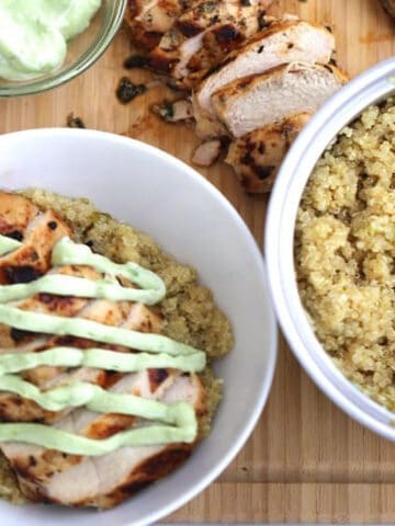 grilled cilantro lime chicken with quinoa, An incredibly juicy and falvorful Cilantro Lime Chicken on a bed of the most delicious Quinoa! chicken with avocado sauce.