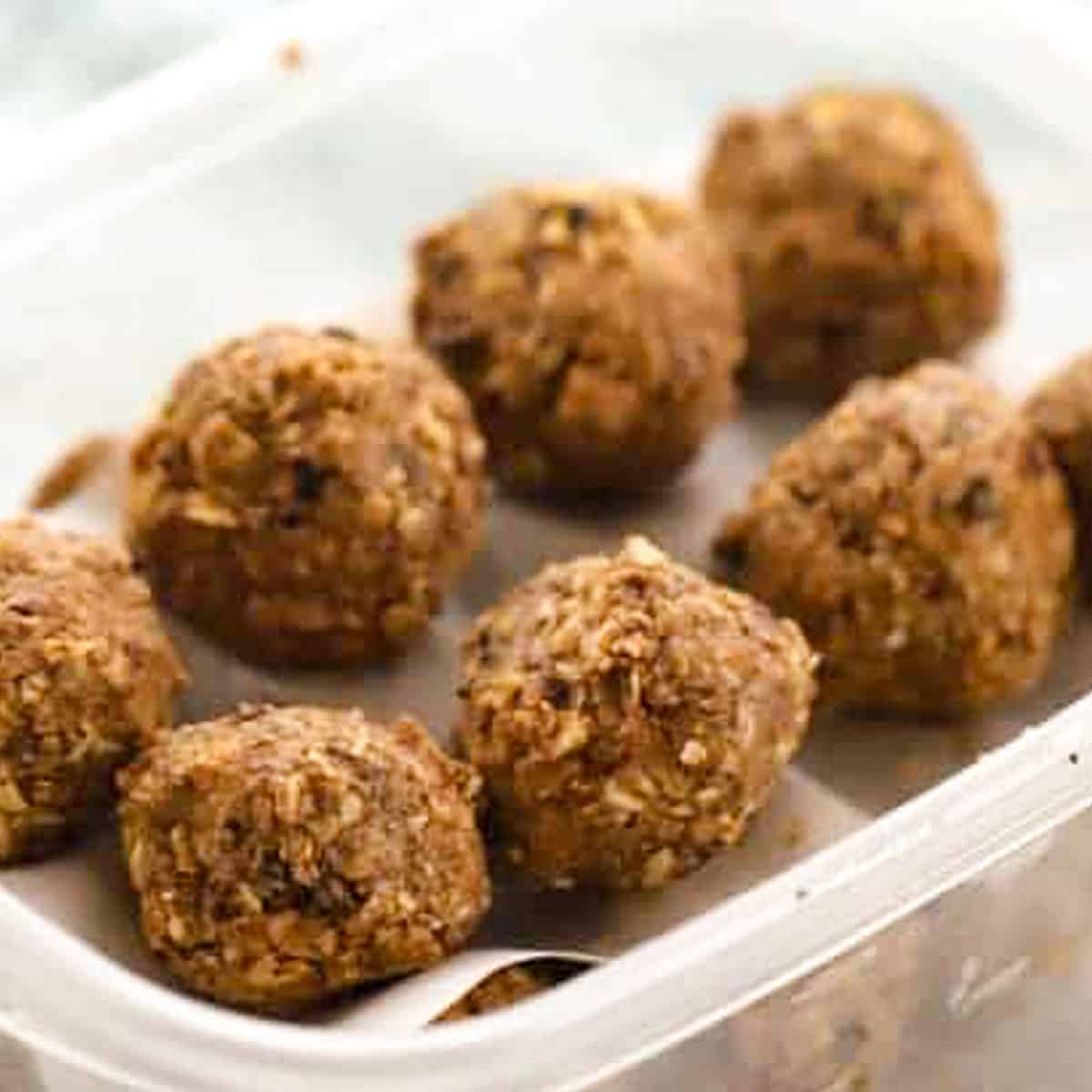 triple chocolate Energy balls in a plastic tupperware container.