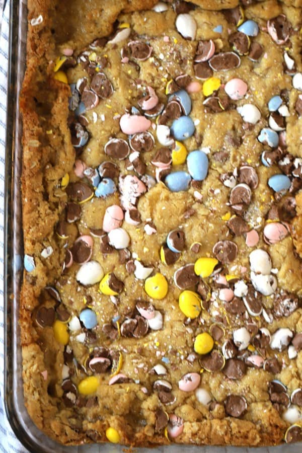 baked and uncut Cadbury Cookie bars in a glass baking dish