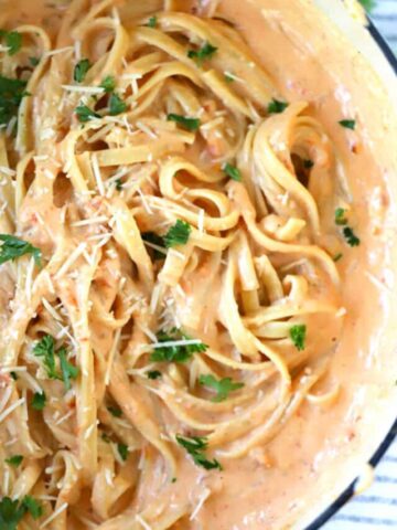 sun dried tomato alfredo fettucini in a large pot