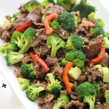 Homemade Teriyaki marinade for easy teriyaki beef and broccoli stir fry on a white plate served with rice, recipes with carne picada