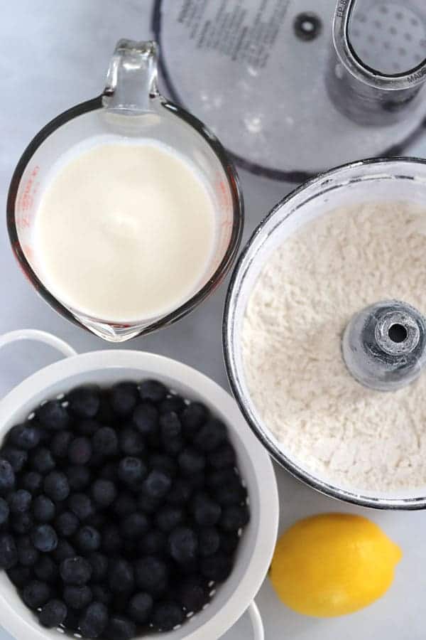 Lemon blueberry scone ingredients on a marble countertop