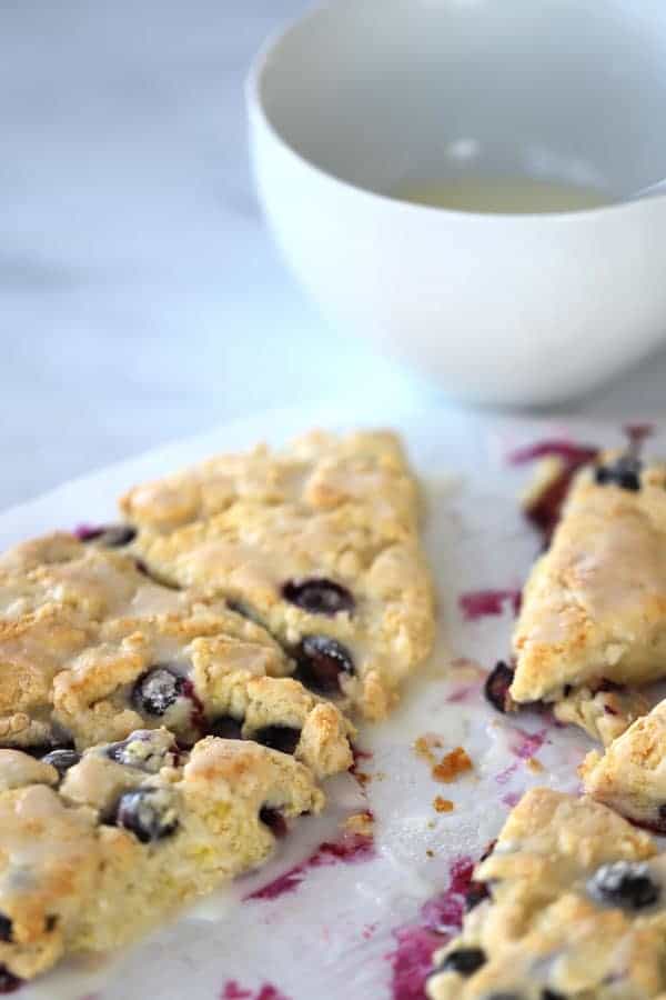 Blueberry Cream scone with lemon glaze. Cut up on a parchment paper after cooking