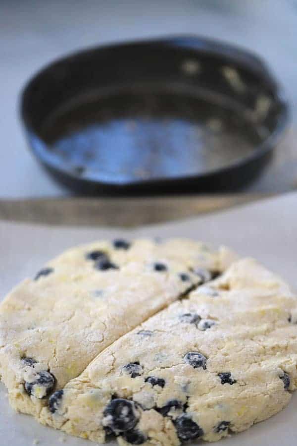 Blueberry scone dough out of a plan, ready to be baked, best lemon blueberry breakfast recipe.