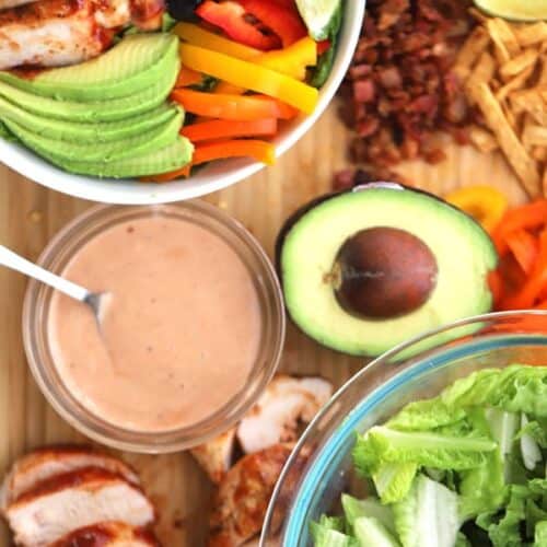 Salad ingredients are grilled chicken, loads of veggies and plenty of tangy BBQ ranch dressing