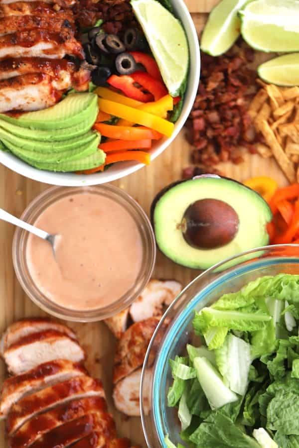 Salad ingredients are grilled chicken, loads of veggies and plenty of tangy BBQ ranch dressing