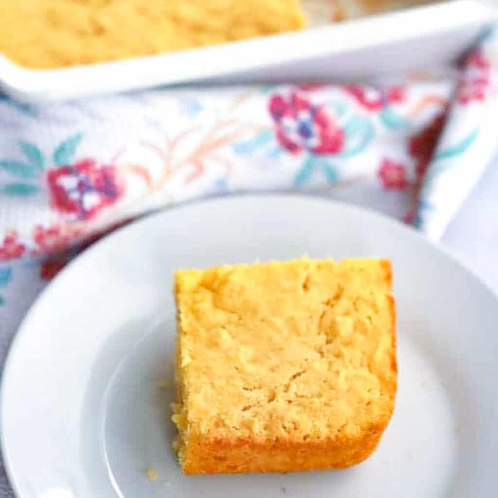 simple corn bread in a baking dish and on a small plate. best thanksgiving side dishes 