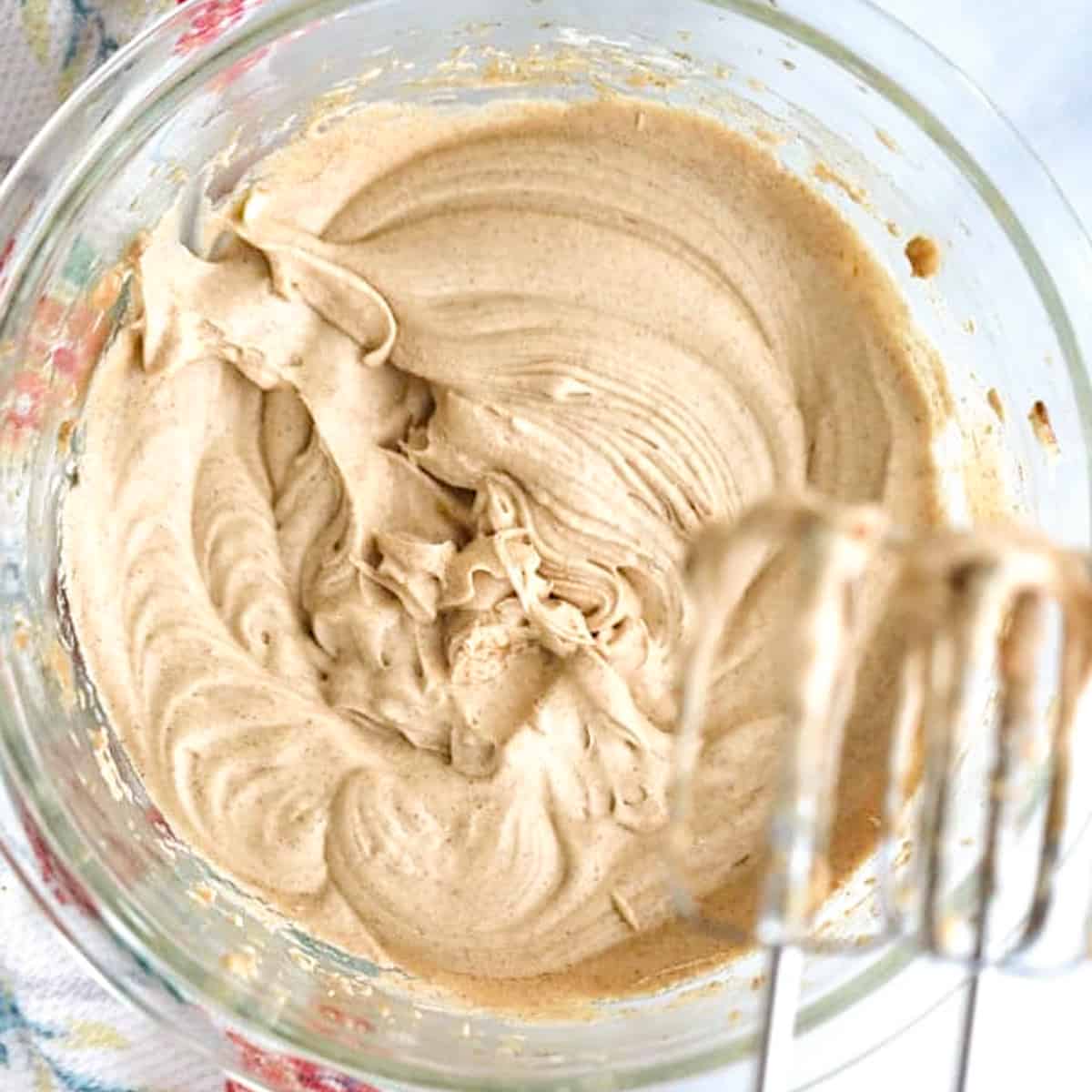 Homemade whipped cinnamon honey butter with an electric hand mixer