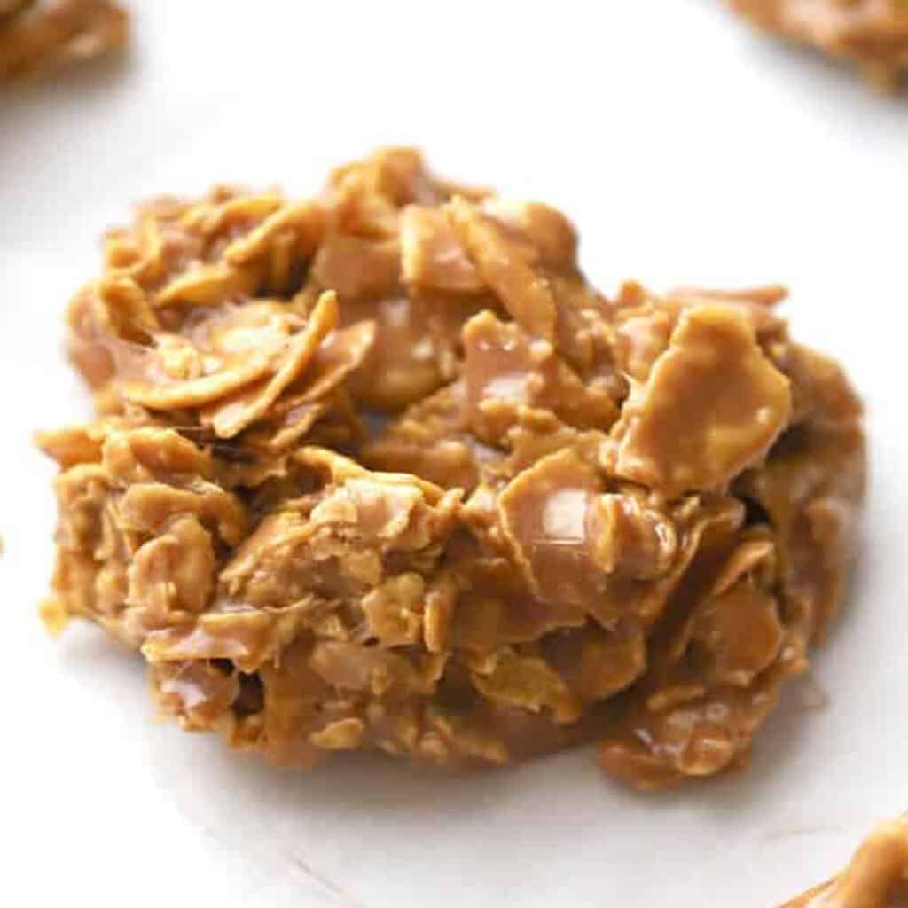 Nutella Cornflake cookies on parchment paper, corn flake dessert, chocolate cornflake cookies.