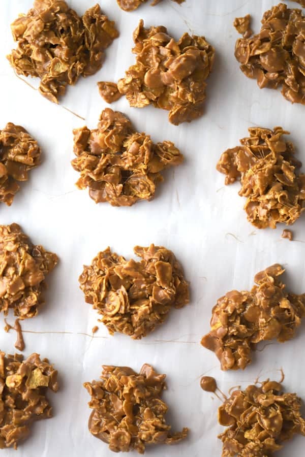 Easy no bake corn flake Cookies with Nutella, cooling and  lined up on parchment paper