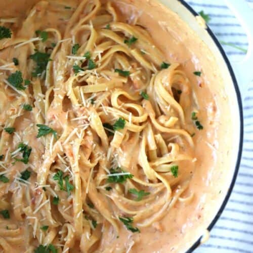 sun dried tomato alfredo fettucini in a large pot