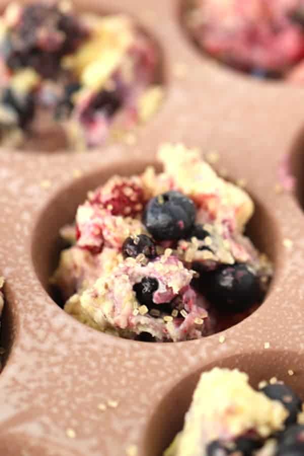 moist berry muffins ready to bake. Sprinkled with raw sugar to make a sugar crusted topping. berry muffins for breakfast. 