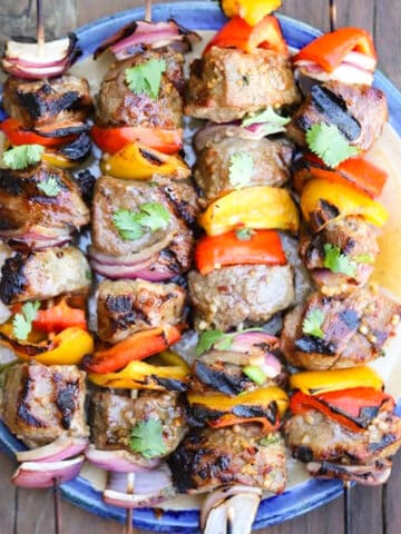 beef shish kabobs cooked after a marinade for beef kabobs. and on a plate