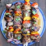 beef shish kabobs cooked and on a plate