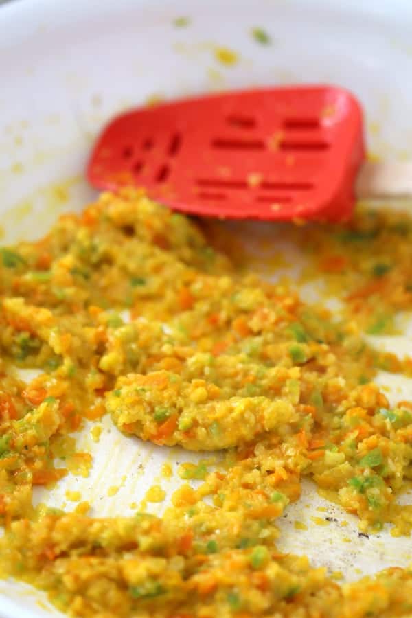 minced Onions, peppers and garlic sauteed in a pan, ready to make this cheddars cheese dip recipe.