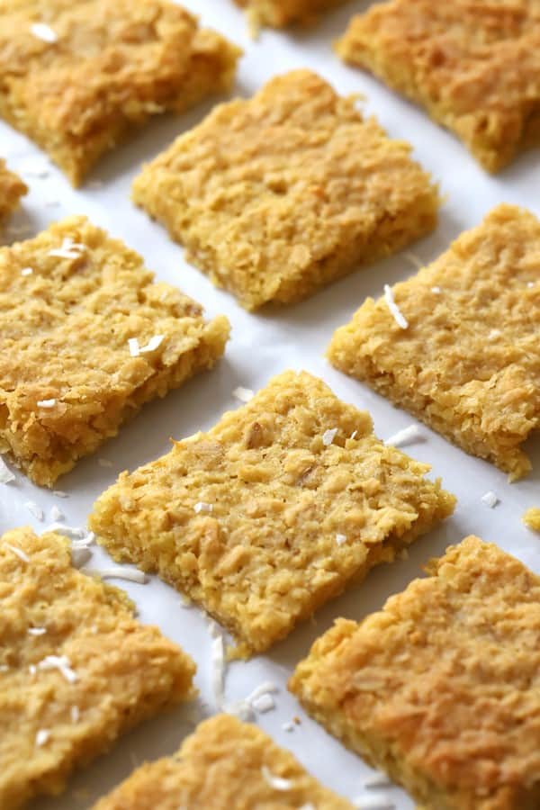 These Coconut Cookie Bars recipe is for you!! They are chewy, and just a little crispy on top, and packed with loads of sweet coconut! These amazing cookie bars are going to be your family favorite in no time!