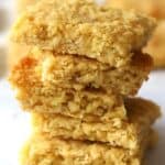 coconut cookie bars stacked on top of each other
