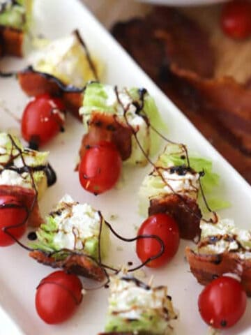 wedge salad kabobs on a serving dish.