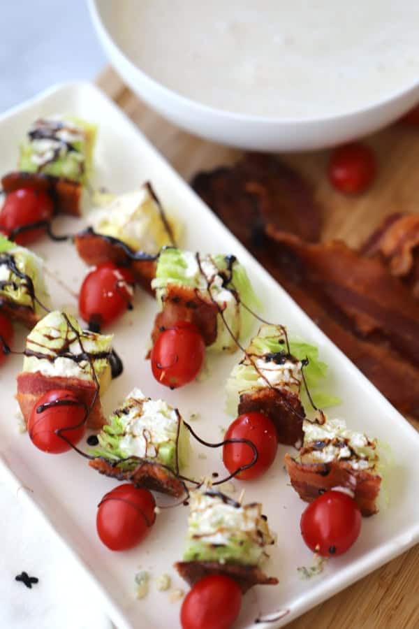 wedge salad kabobs on a serving dish.