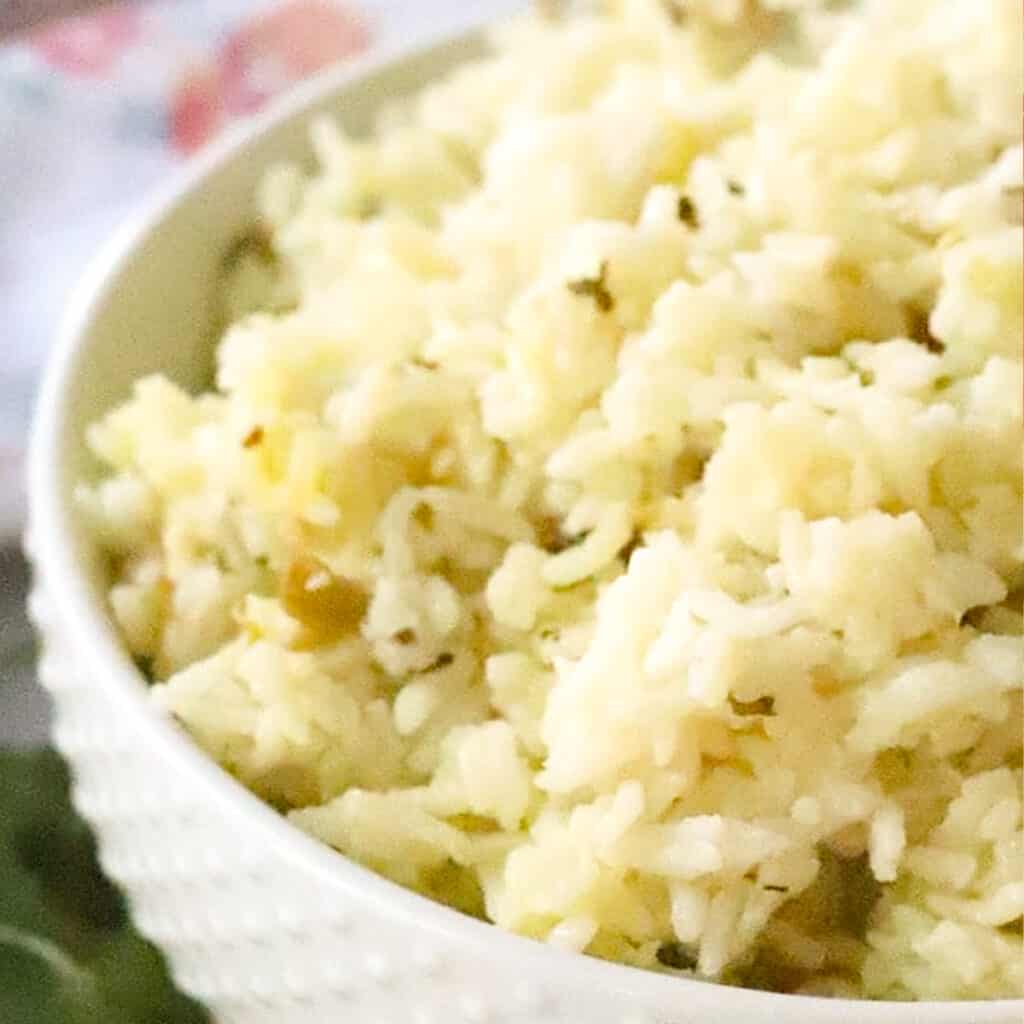 chipotle cilantro lime rice in a white serving bowl, an easy chipotle rice copycat recipe.