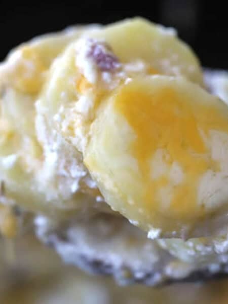 ham and cheese scalloped potatoes made in a crockpot. Slow cooker scalloped potatoes and ham with creamy white sauce