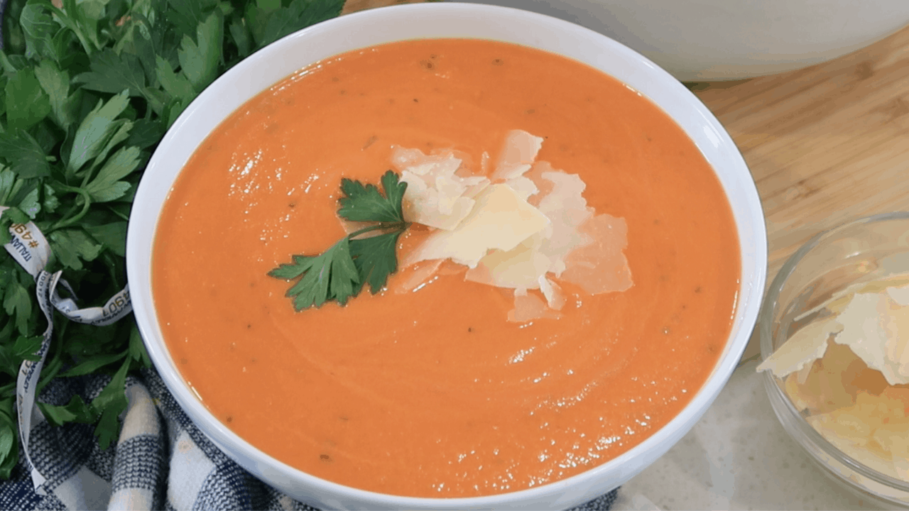 Simple Tomato Soup Recipe in a white bowl, creamy tomato soup resh tomatoes.