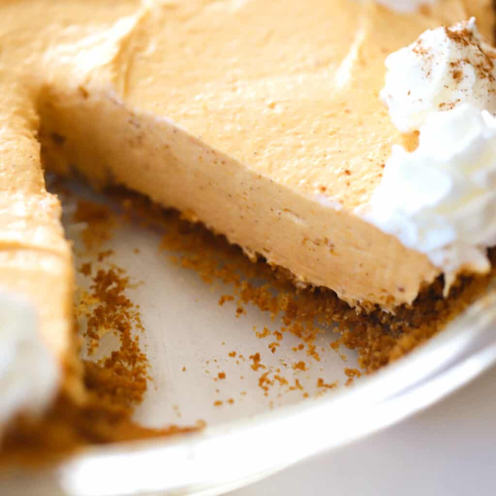 easy no bake pumpkin cheesecake with a slice removed.