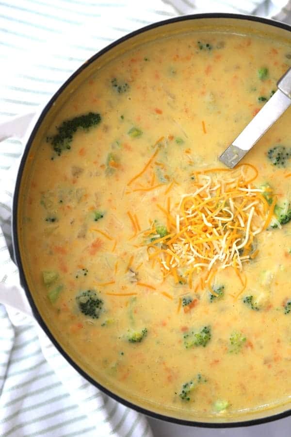 broccoli cheddar and potato soup recipe in a large white dutch oven. potato cheddar broccoli soup, potato cheese broccoli soup, potato and broccoli soup, potato broccoli soup, potato broccoli cheddar soup.