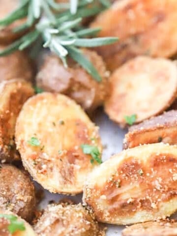 Rosemary and Parmesan Fingerling Potatoes on a baking sheet.