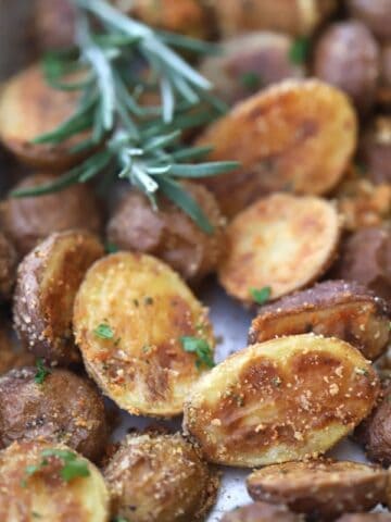 Rosemary and Parmesan Fingerling Potatoes on a baking sheet.