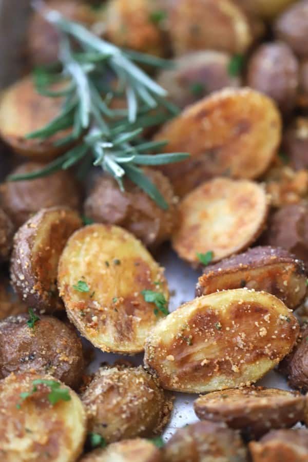 Rosemary and Parmesan Fingerling Potatoes on a baking sheet.