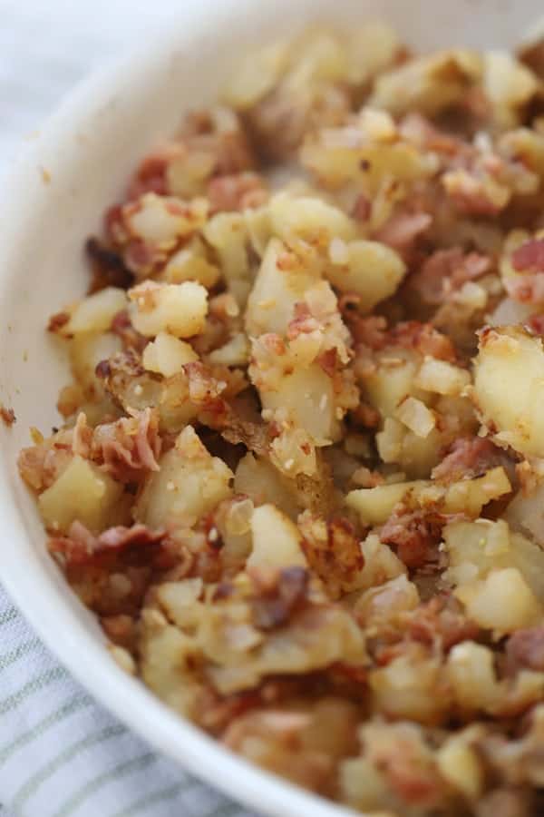 breakfast Hash Brown potatoes recipe in a skillet.cheesy potatoes with hash browns. idaho spuds hash browns.