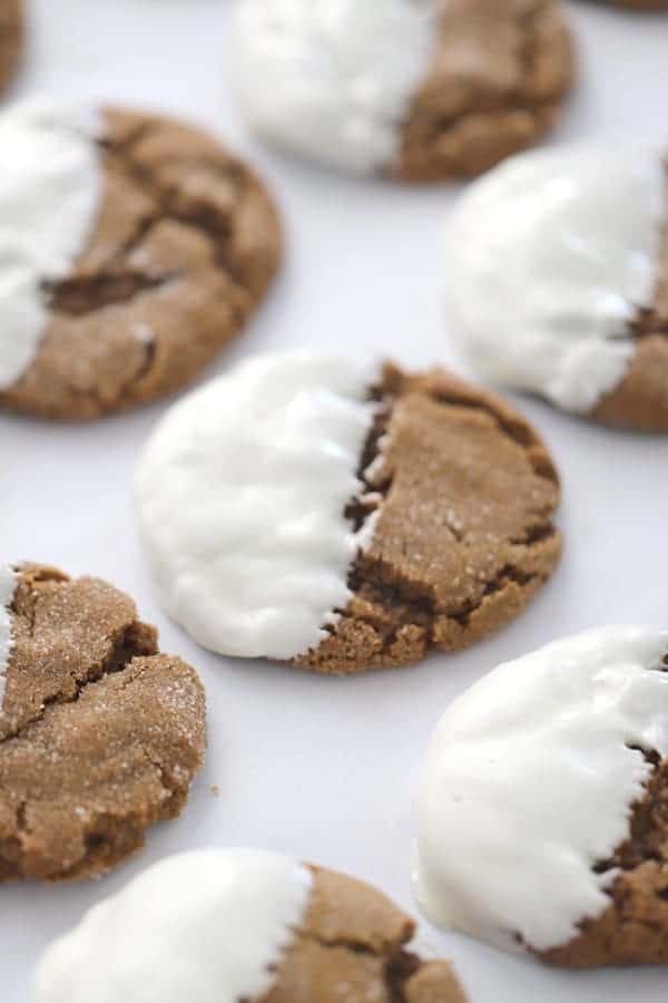 Soft Gingersnap Cookies half dipped in white chocolate.