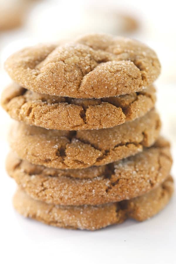 Chewy ginger snap cookies stacked on top of each other. This ginger snaps recipe is easy to follow and perfect for the holidays.