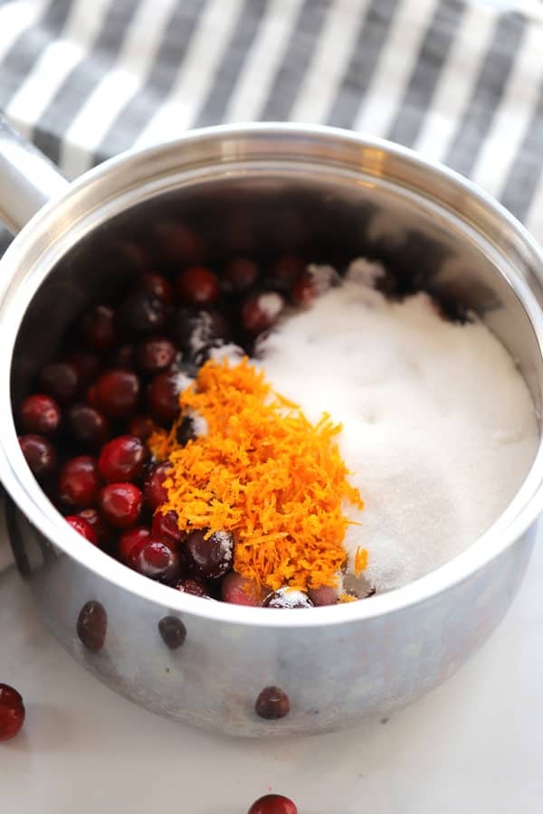 Cranberry sauce ingredients in a saucepan.