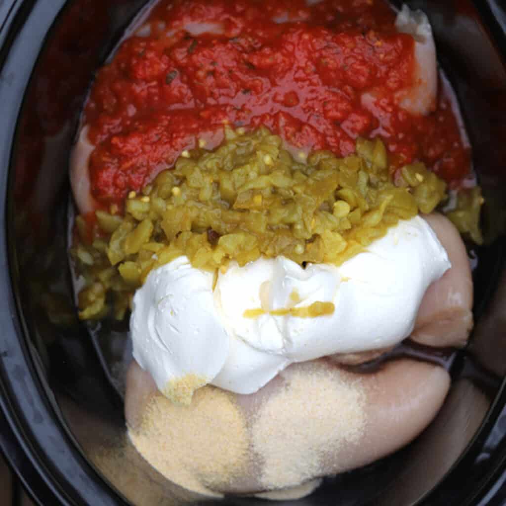 crock pot salsa chicken ingredients in a slow cooker, easy and cheap dinner ideas.