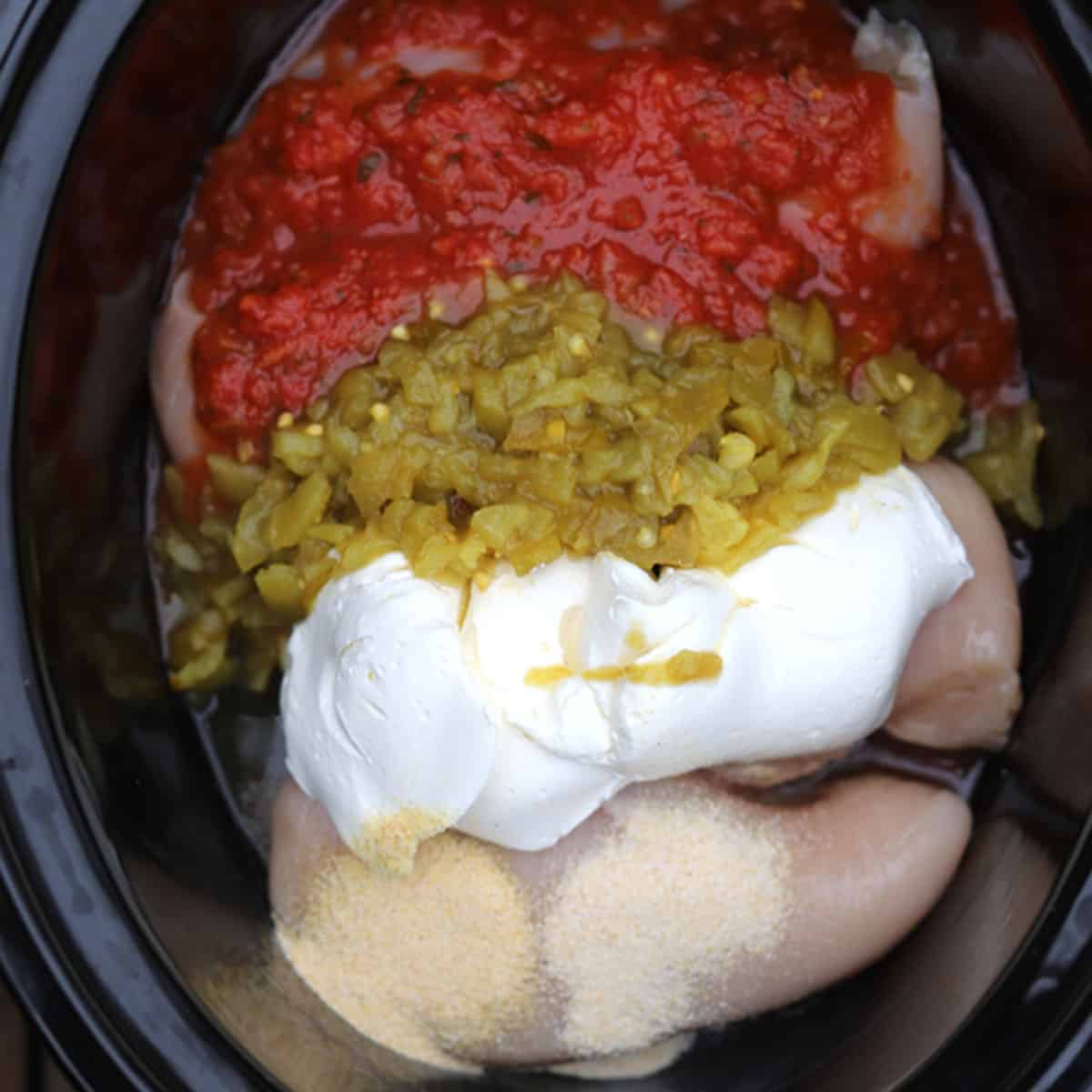 crock pot salsa chicken ingredients in a slow cooker