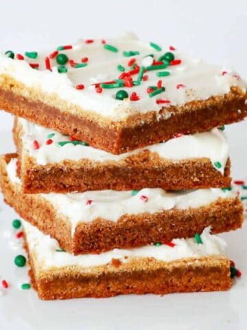 Gingerbread cookie bars with red and green sprinkles, spiced gingerbread.