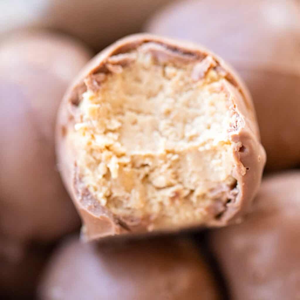 buckeye balls or peanut butter balls in a christmas gift box, peanut butter balls with graham crackers.