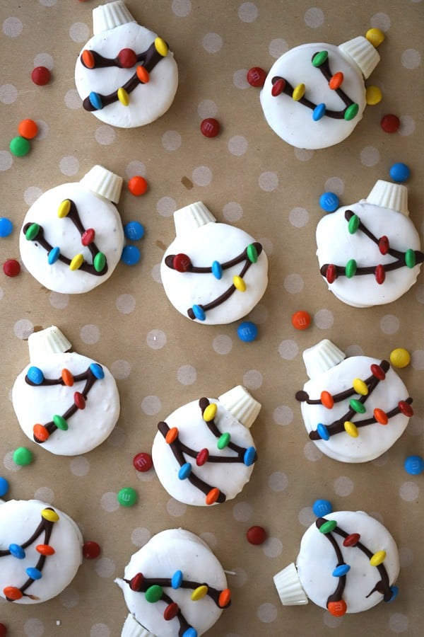 White chocolate dipped Oreo cookies, decorated to look like ornaments.
