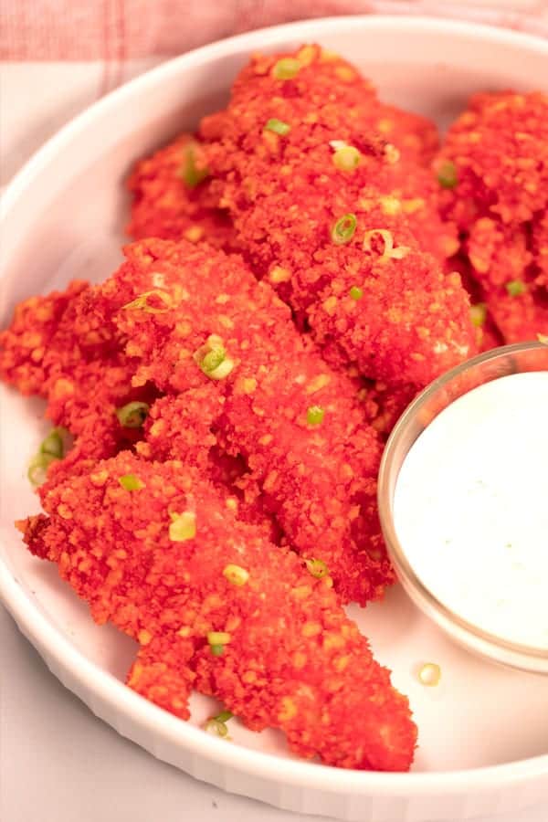 hot cheeeto chicken tenders on a platter. flomin hot cheetos chicken. how to make hot cheeto chicken. 