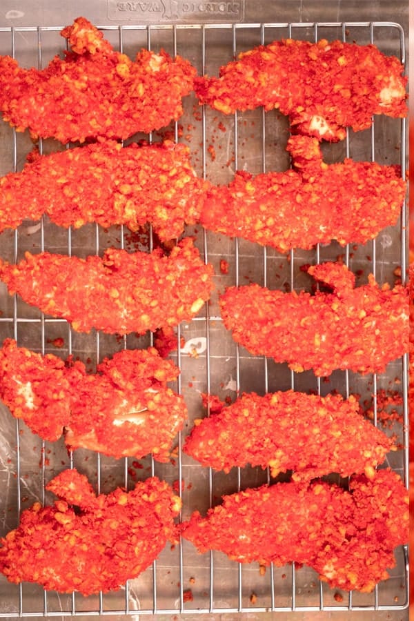 hot cheeto chicken tenders recipe on a platter with ranch dressing. hot cheetos chicken. 