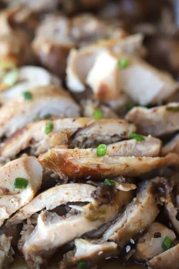 Crockpot teriyaki chicken topped with scallions.