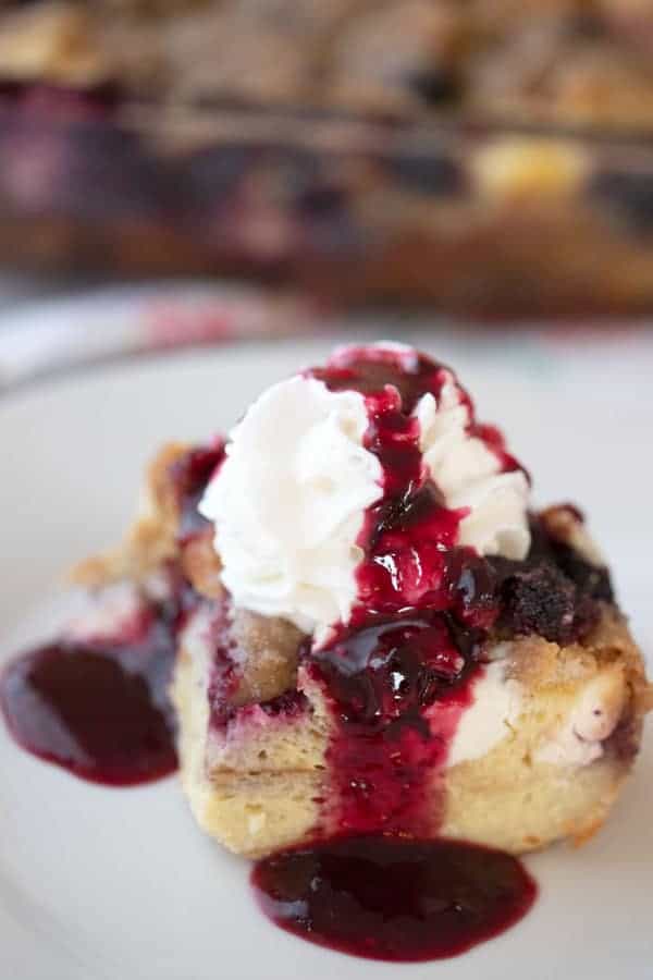 This is an easy mixed berry overnight French toast bake.  It’s made with simple ingredients, frozen mixed berries, milk, cream cheese, and eggs.  It’s a delicious overnight French toast casserole with streusel topping.