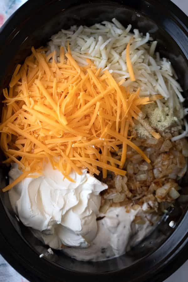 Cheesy hash brown potatoes ingredients in a crockpot