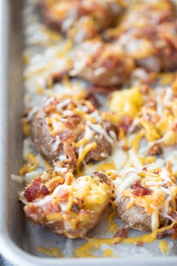 smashed potatoes recipe on a baking dish, easy potato recipe.