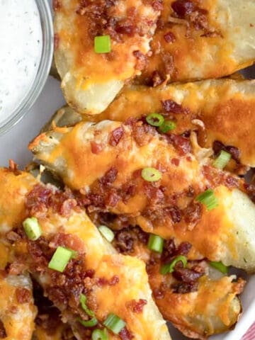 loaded baked potato skins reicipe with cheese and bacon, easy baked potato skins recipe