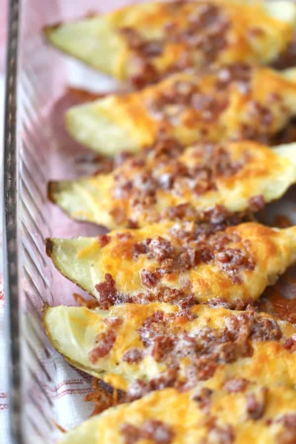 loaded potato skins in a baking dish.